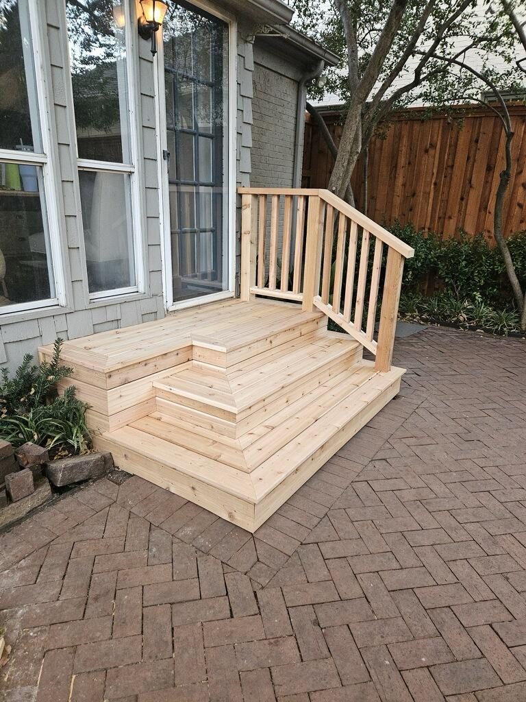 Brand-new custom cedar entry steps with a matching handrail